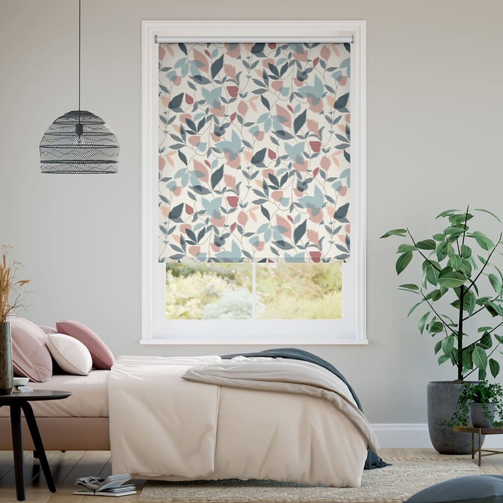 How to clean blinds - image shows a patterned roller blind in a bedroom interior