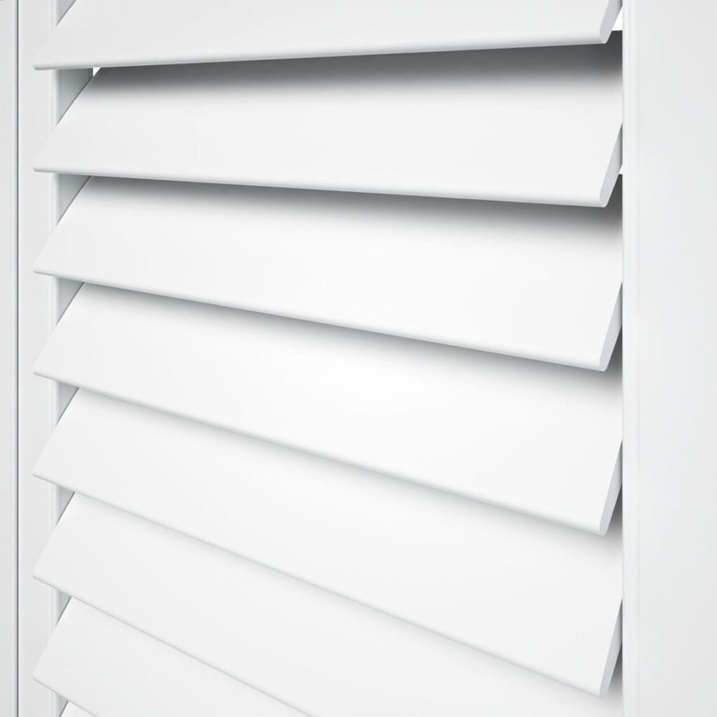 A closeup image of the white plantation shutter blinds. 