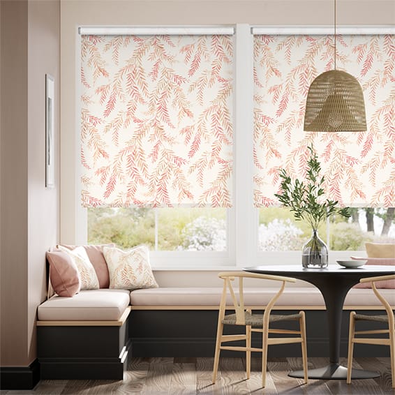 Dappled ferns in a pink colour way adorn roller blinds in this dining interior. 