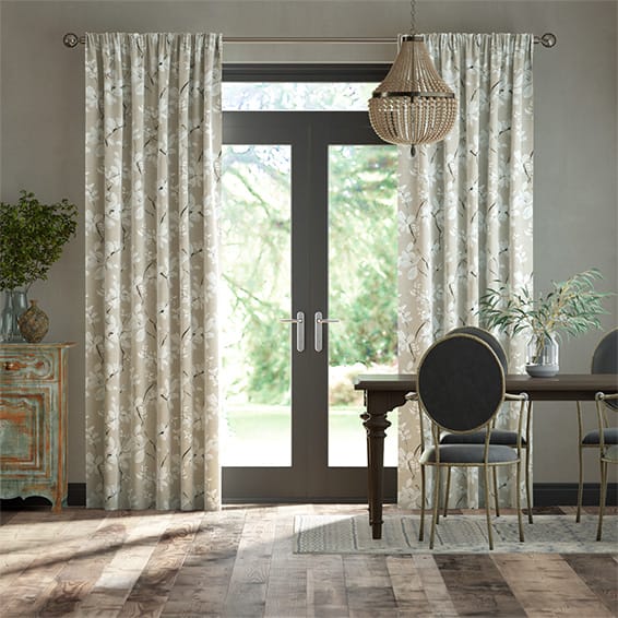 Curtains with a pencil pleat heading in a dining room. 